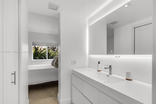 bathroom with vanity and tile patterned floors