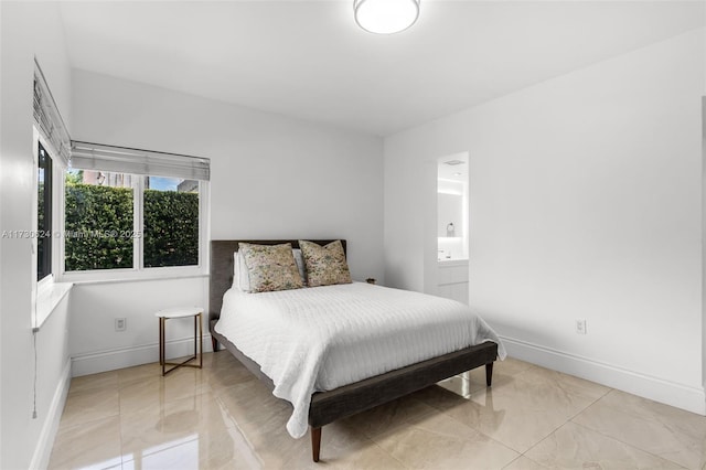 bedroom featuring connected bathroom