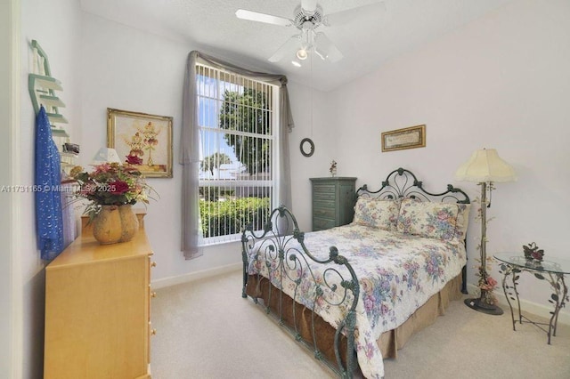 bedroom with ceiling fan and light colored carpet