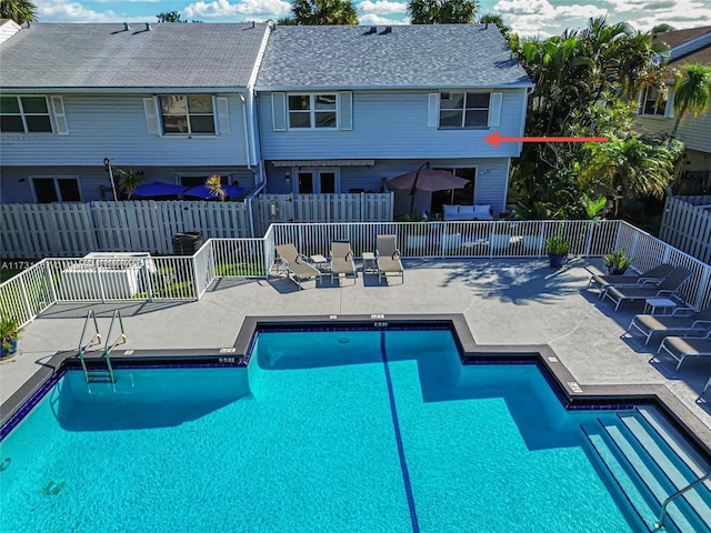 view of swimming pool with a patio area