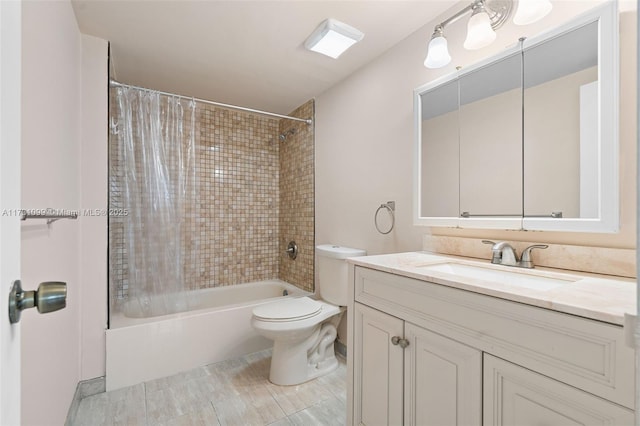 full bathroom featuring tub / shower combination, toilet, and vanity