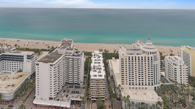 aerial view featuring a water view and a beach view