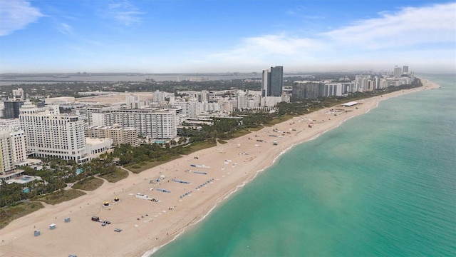 aerial view featuring a view of the beach and a water view