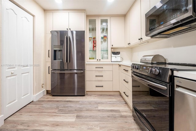 kitchen featuring light hardwood / wood-style floors and stainless steel appliances