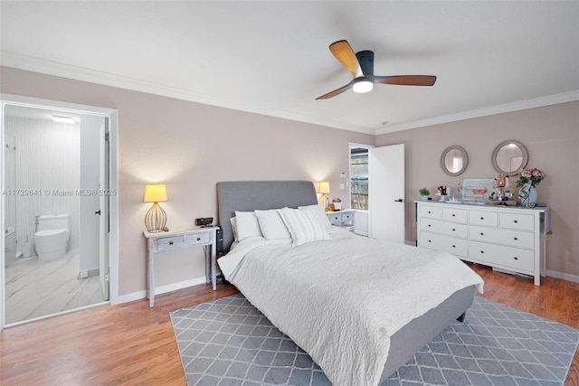 bedroom featuring ceiling fan, hardwood / wood-style flooring, ensuite bathroom, and ornamental molding