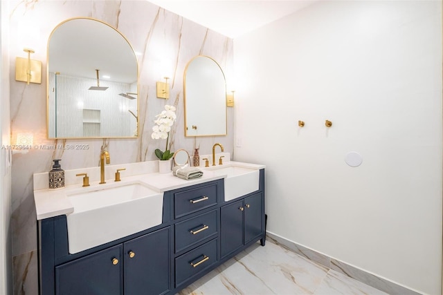 bathroom with a shower and vanity