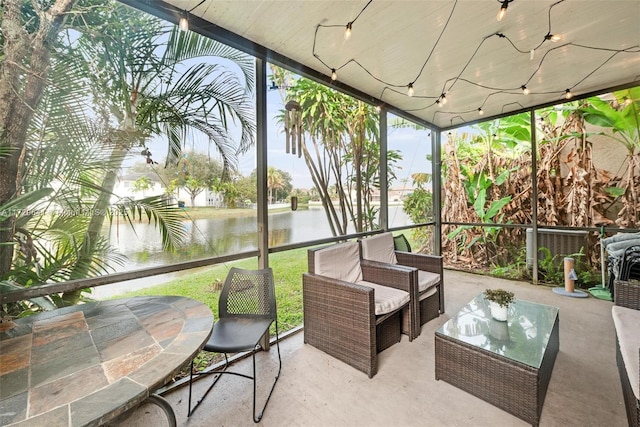 sunroom with a water view