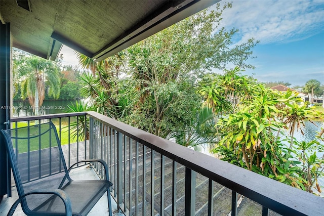 balcony featuring a water view