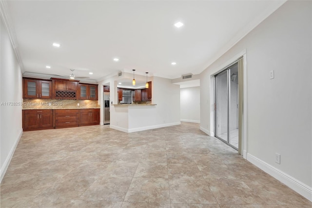 interior space with ornamental molding and ceiling fan