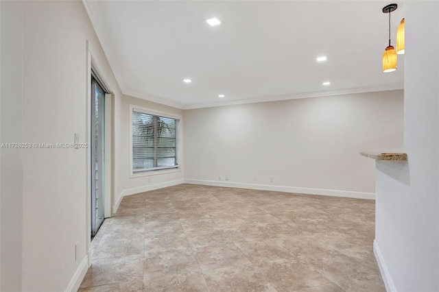 spare room with crown molding