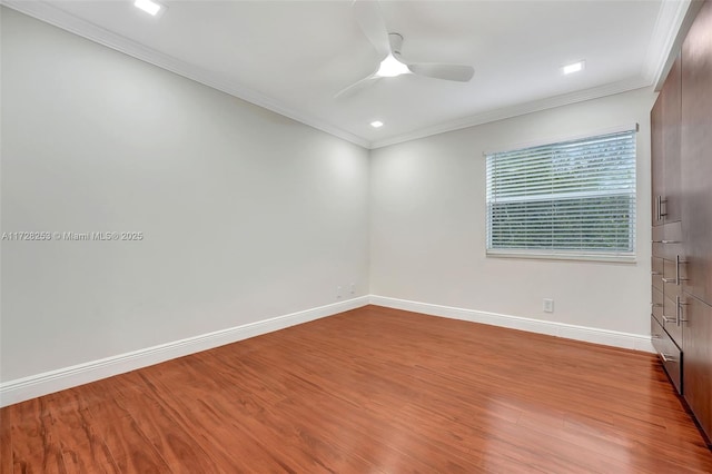 unfurnished room with ceiling fan, ornamental molding, and light hardwood / wood-style floors