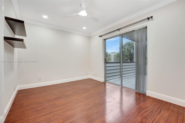 empty room featuring ornamental molding, hardwood / wood-style floors, and ceiling fan