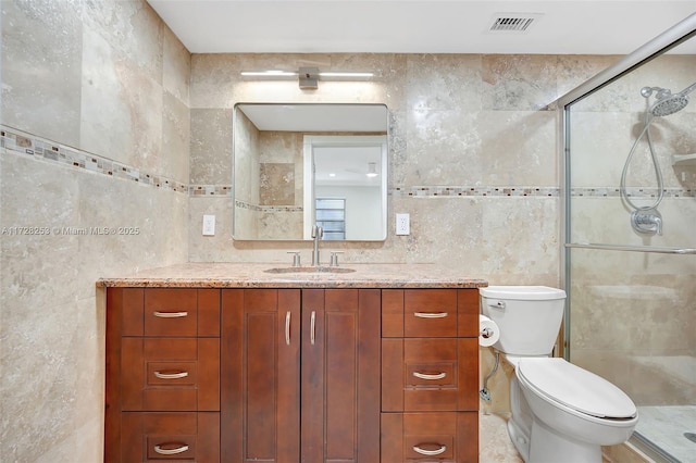 3100 Riverside Dr Unit 306, Coral Springs, FL 33065 - full bathroom featuring tile walls, vanity, a stall shower, and toilet