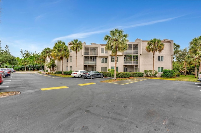 3100 Riverside Dr Unit 306, Coral Springs, FL 33065 - view of property featuring uncovered parking