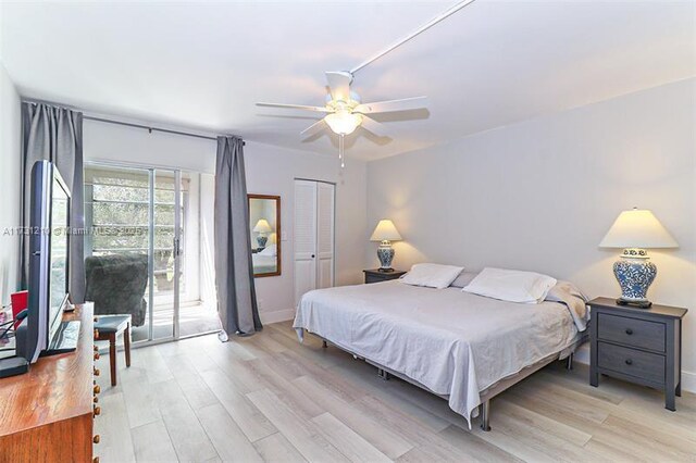 bedroom featuring light hardwood / wood-style flooring, a closet, ceiling fan, and access to outside