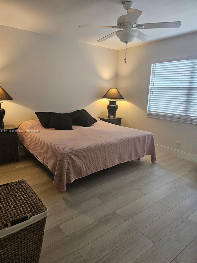 bedroom featuring ceiling fan and light hardwood / wood-style floors