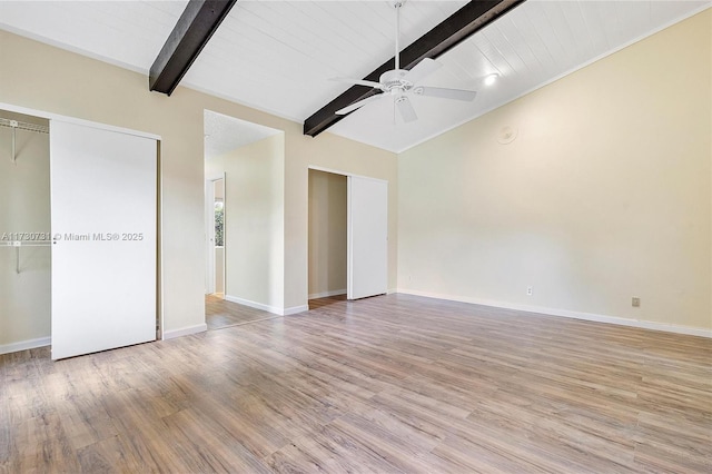 unfurnished bedroom with lofted ceiling with beams, ceiling fan, and light hardwood / wood-style floors