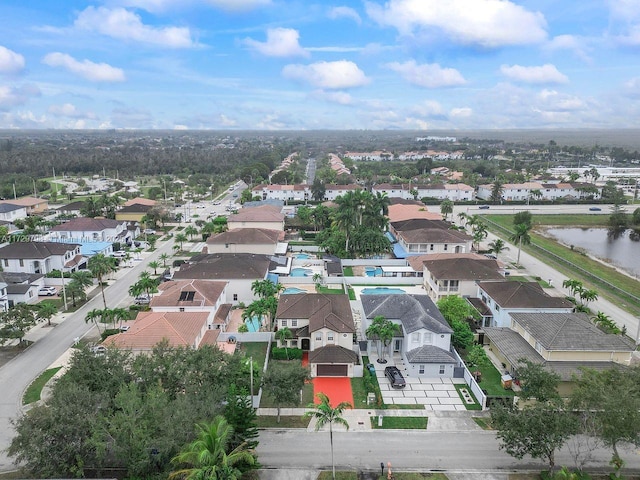 birds eye view of property with a residential view