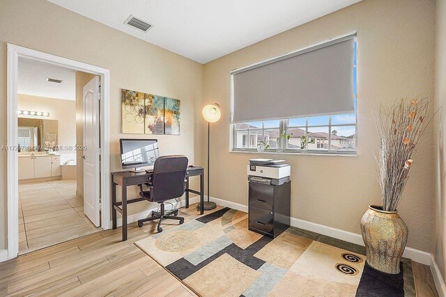 office space featuring light wood-type flooring