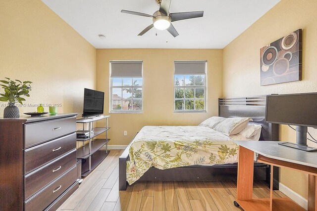 bedroom featuring light hardwood / wood-style floors and ceiling fan