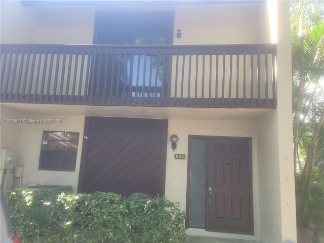 entrance to property with a balcony