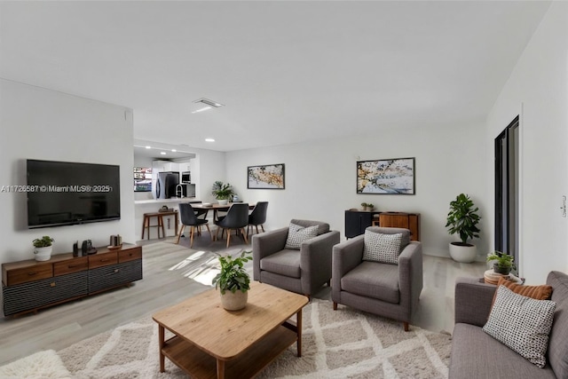 living room featuring light wood-type flooring