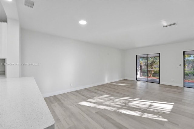 unfurnished room featuring light hardwood / wood-style flooring