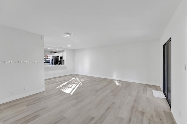 unfurnished living room featuring light hardwood / wood-style flooring