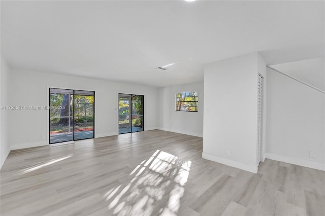 unfurnished living room featuring light hardwood / wood-style floors