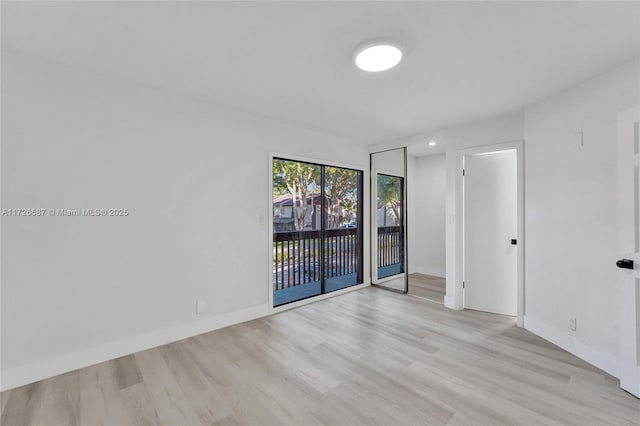 spare room featuring light wood-type flooring