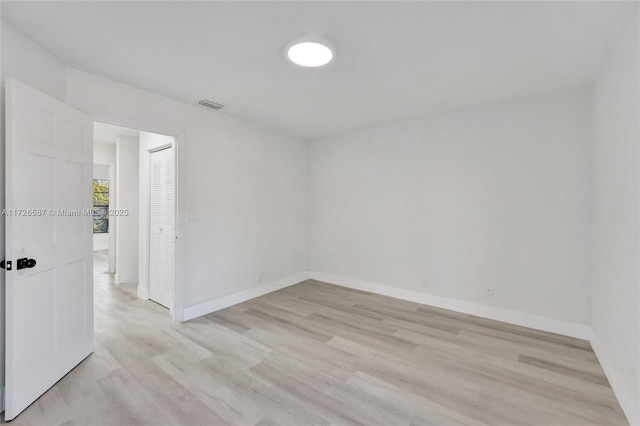 unfurnished room featuring light hardwood / wood-style floors