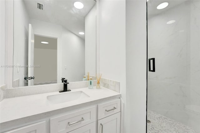 bathroom featuring vanity and walk in shower