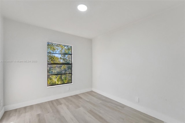 unfurnished room featuring light wood-type flooring