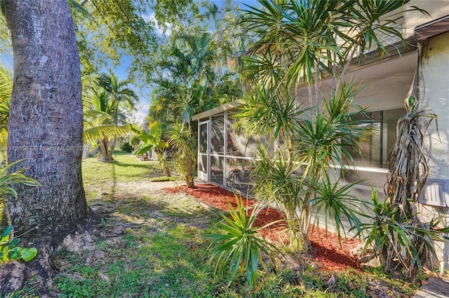 view of yard with a sunroom