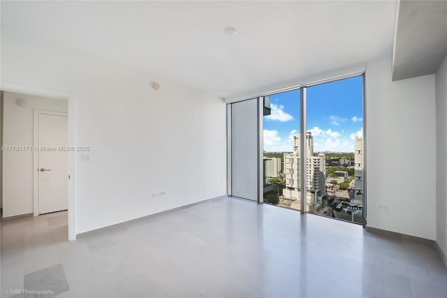 empty room featuring expansive windows