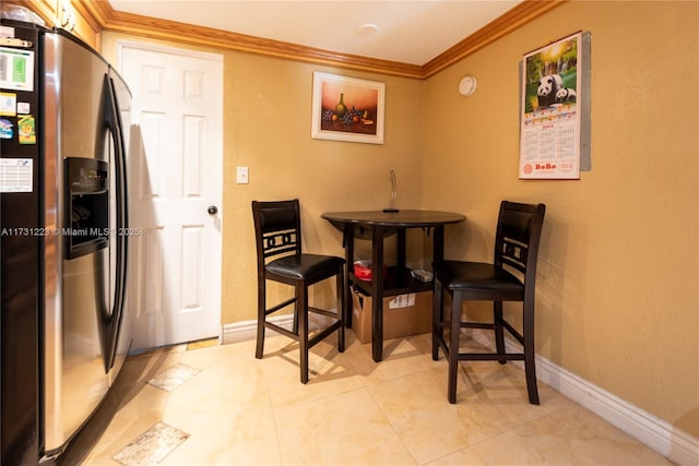 dining area with ornamental molding