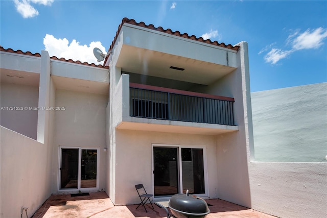 rear view of house featuring a patio area