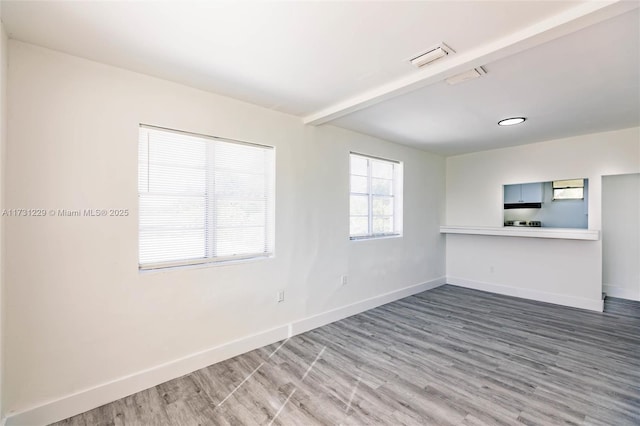 unfurnished room featuring wood-type flooring