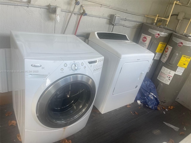 laundry room with separate washer and dryer and electric water heater