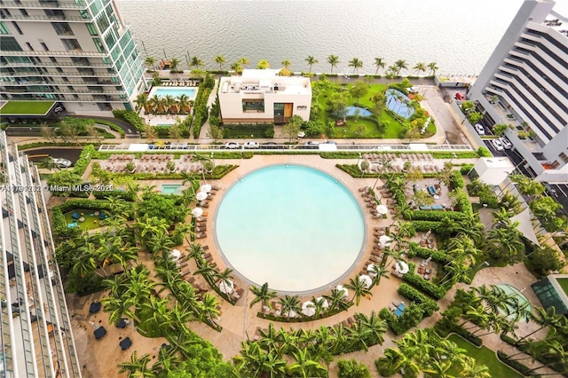 birds eye view of property with a water view