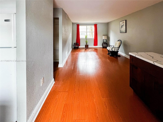 hallway featuring light wood-type flooring