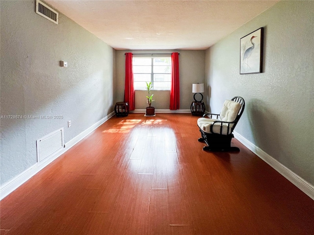 unfurnished room with light wood-type flooring