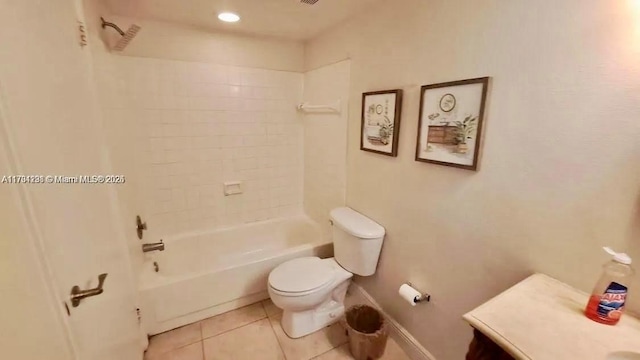 full bathroom featuring vanity, tiled shower / bath combo, tile patterned floors, and toilet