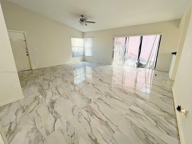 empty room with lofted ceiling and ceiling fan