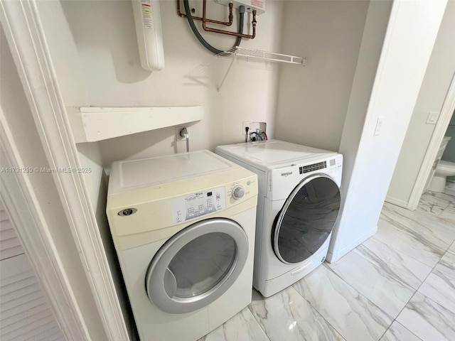 washroom featuring independent washer and dryer