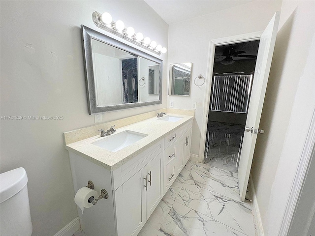 bathroom featuring vanity and toilet