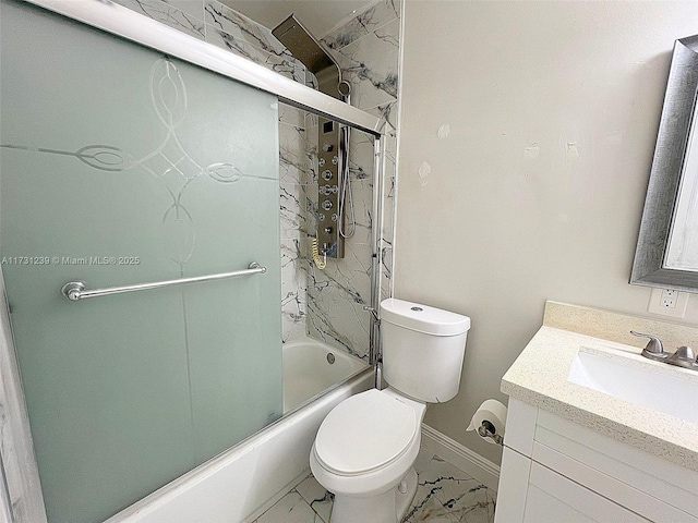 full bathroom featuring vanity, shower / bath combination with glass door, and toilet