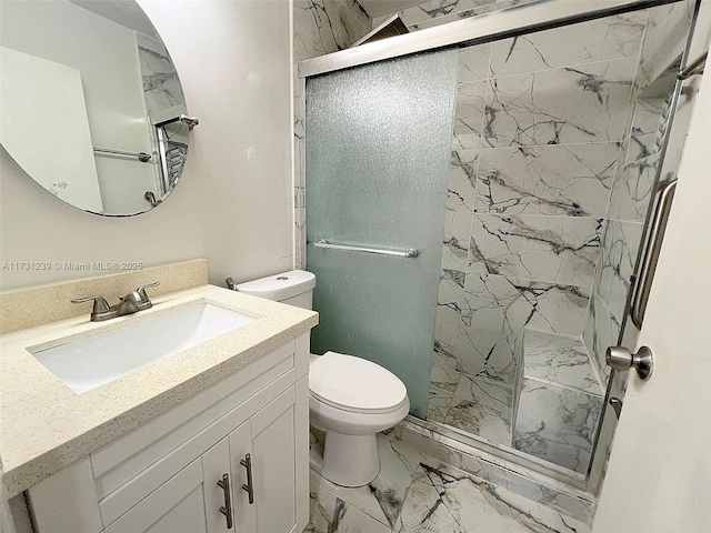 bathroom with vanity, toilet, and an enclosed shower