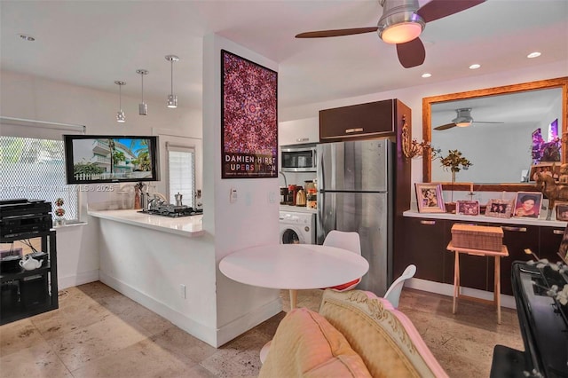 kitchen featuring washer / clothes dryer, stainless steel appliances, and ceiling fan