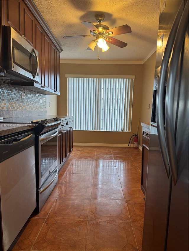 6150 NW 62nd St Unit 312, Tamarac, FL 33319 - kitchen with a textured ceiling, crown molding, stainless steel appliances, a ceiling fan, and backsplash